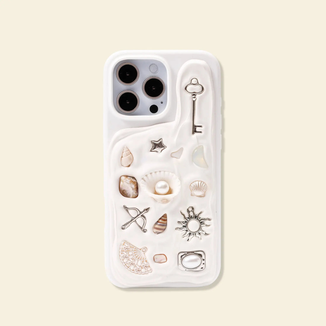 Personalised charm phone case with evil eye, sun, key and cupid charms from The Charmé Edit