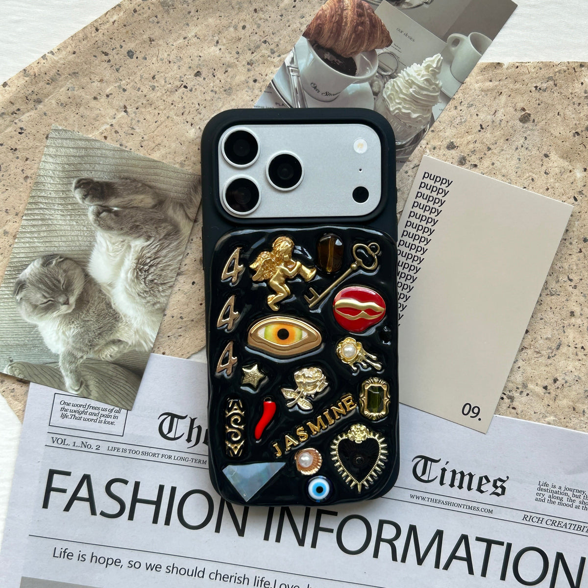 A handmade charm phone case from The Charmé Edit, an iPhone 17 case Christmas gift idea