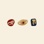 custom phone case accessories: gold eye, tooth, and lip charms for phone cases.