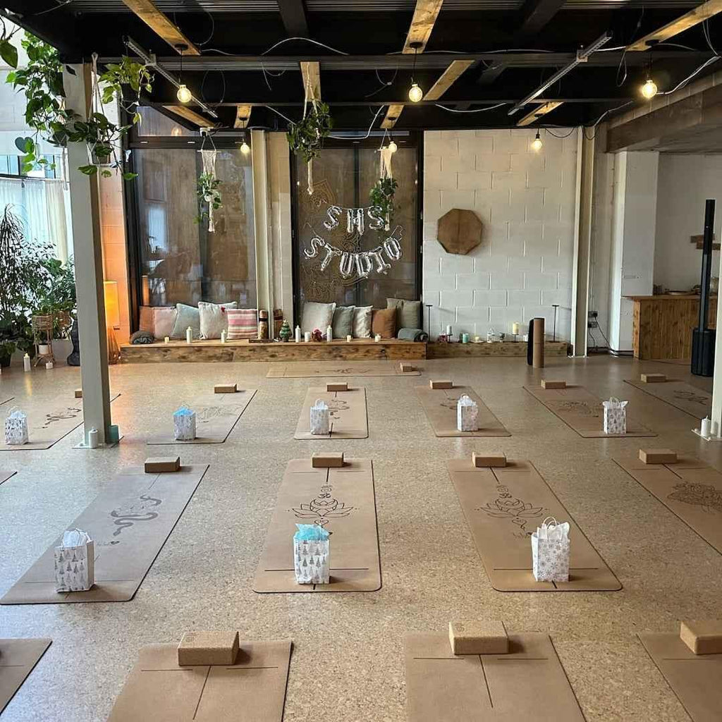 Yoga studio with mats and candles arranged in a row