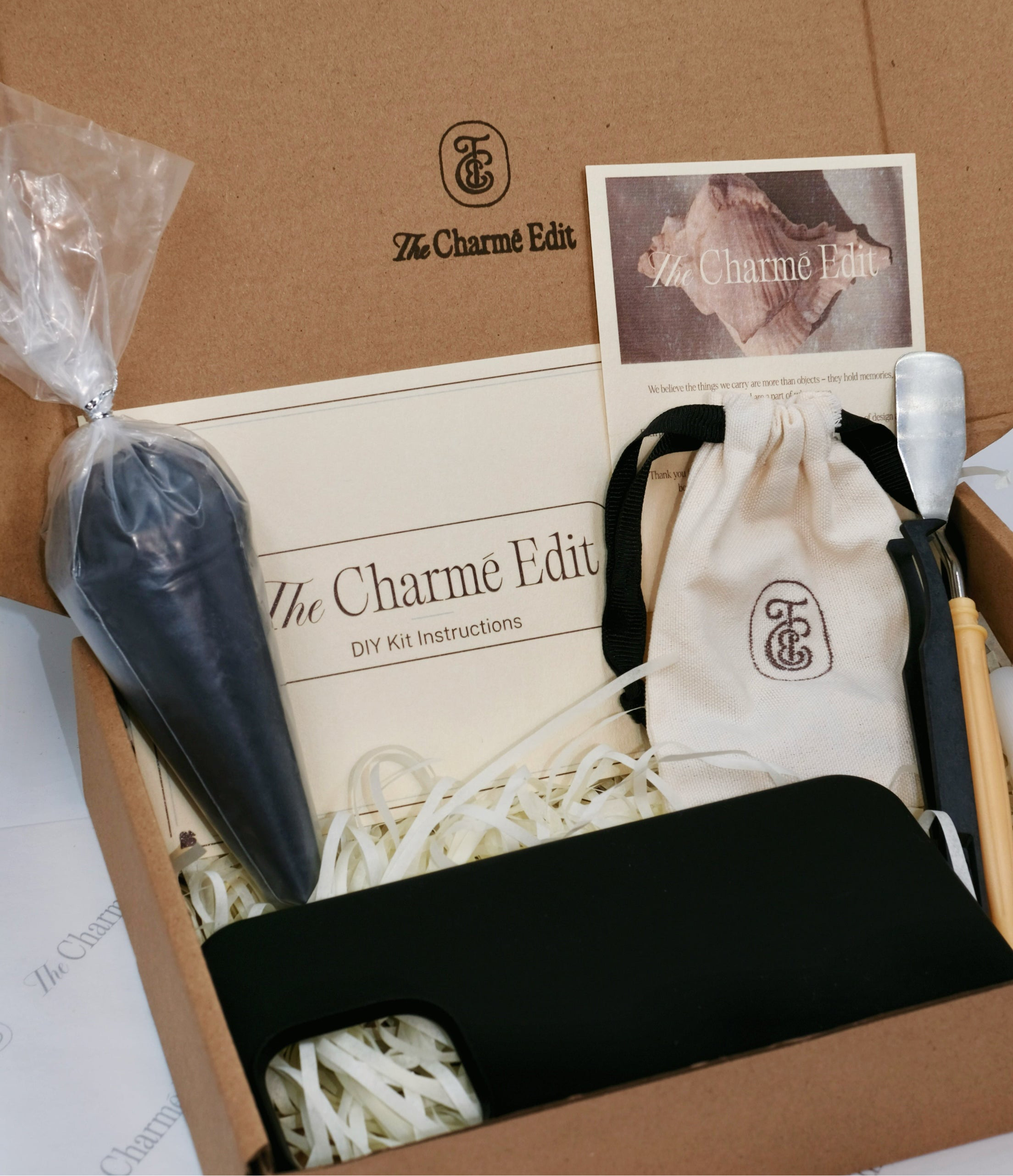 The Charme Edit DIY phone case kit with charms, seashells, tools, and materials to create a custom handmade iPhone case. Perfect for birthdays, creative gifts, craft parties, or a relaxing self-care project.