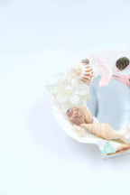 gift coquette room decor: handmade seashell mirror with blue mermaid tail charms.