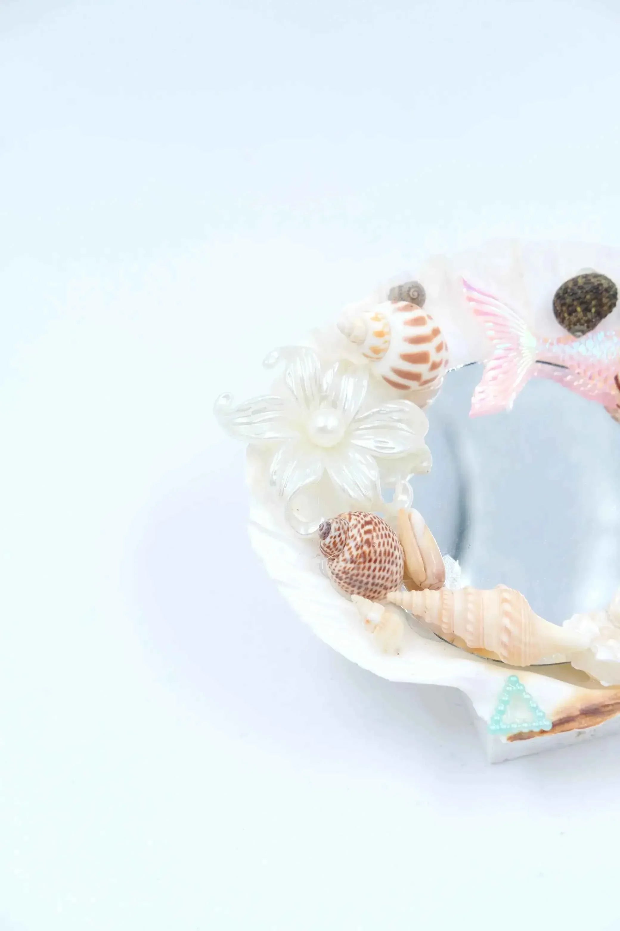 gift coquette room decor: handmade seashell mirror with blue mermaid tail charms.