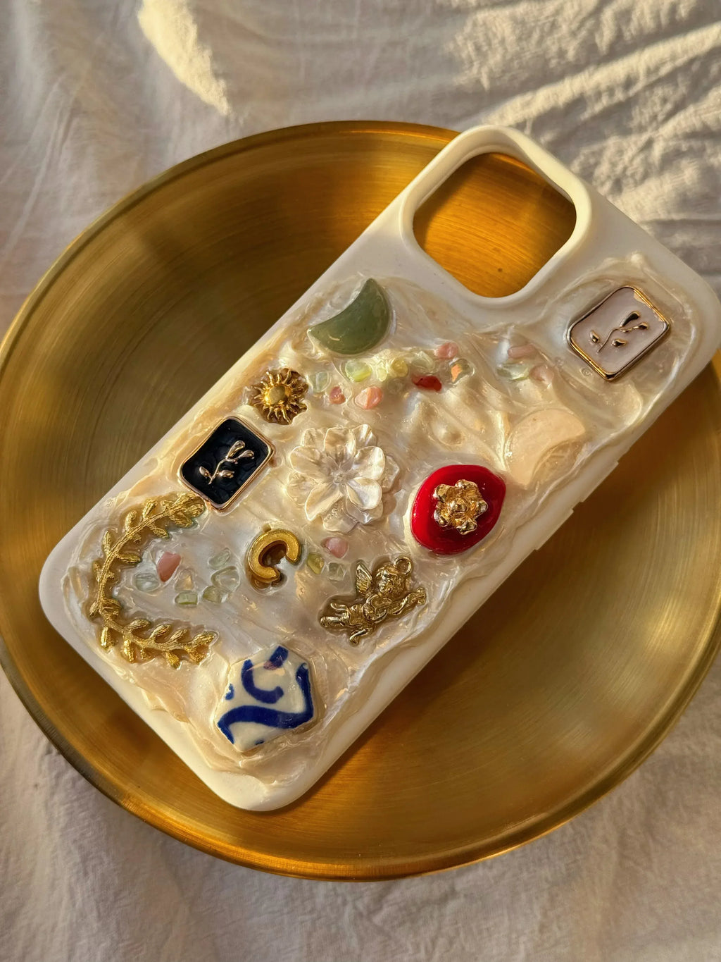 Made-to-order iPhone phone case with charms, handmade small luxury tech accessory, perfect self-gift or treat under £40.