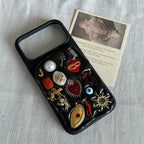 black charm iPhone 17 Pro Max phone case with red heart eye and gold details, bold aesthetic custom handmade phone case