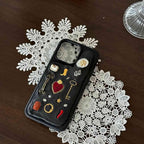 iPhone 15 phone case with embellishments on a lace doily
