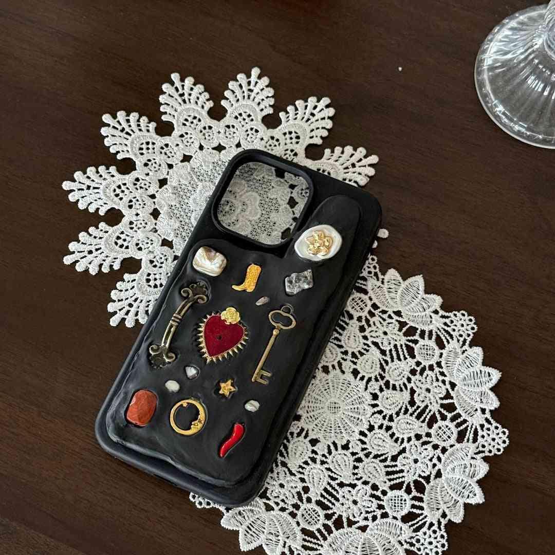 iPhone 15 phone case with embellishments on a lace doily