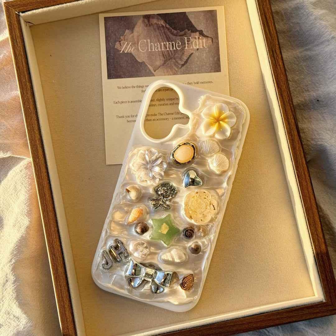 iPhone 16 phone case with shells and flowers in a wooden frame