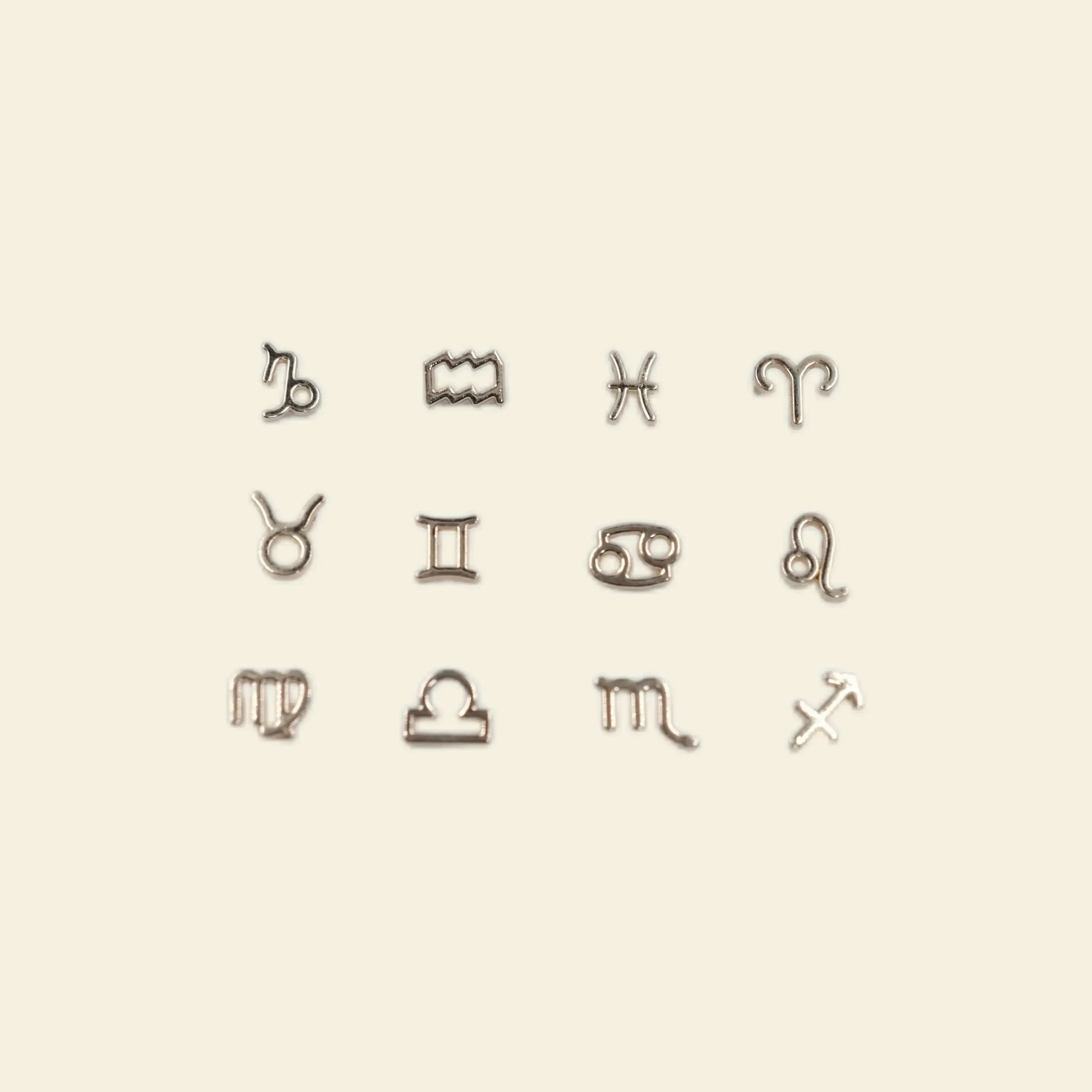 aesthetic phone charms: gold astrology zodiac sign charms for phone cases.