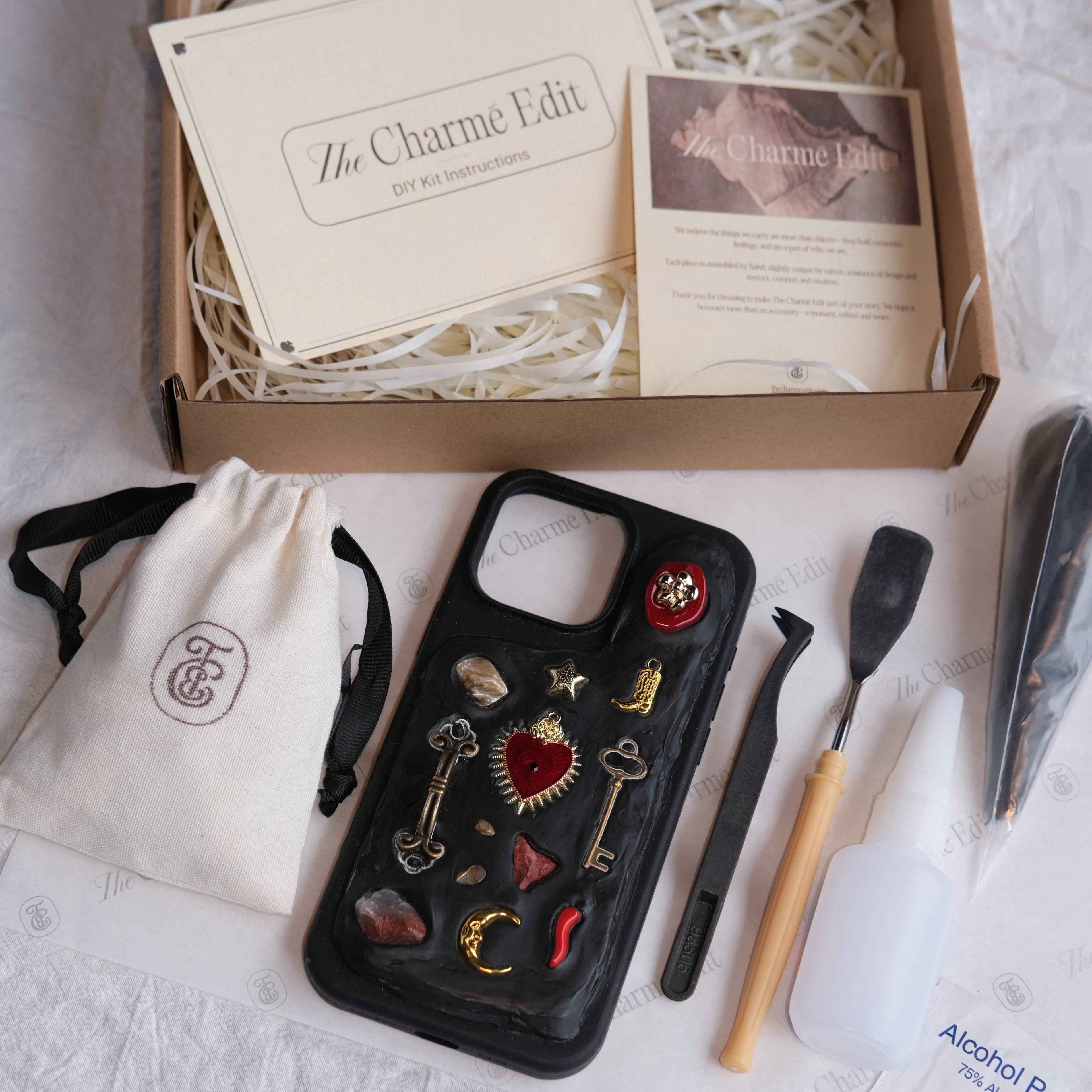 The Charme Edit DIY phone case kit with charms, seashells, tools, and materials to create a handmade custom iPhone case. Perfect for birthdays, creative gifts, craft parties, or a relaxing self-care project. | Craft ideas, custom phone cases, DIY phone cases