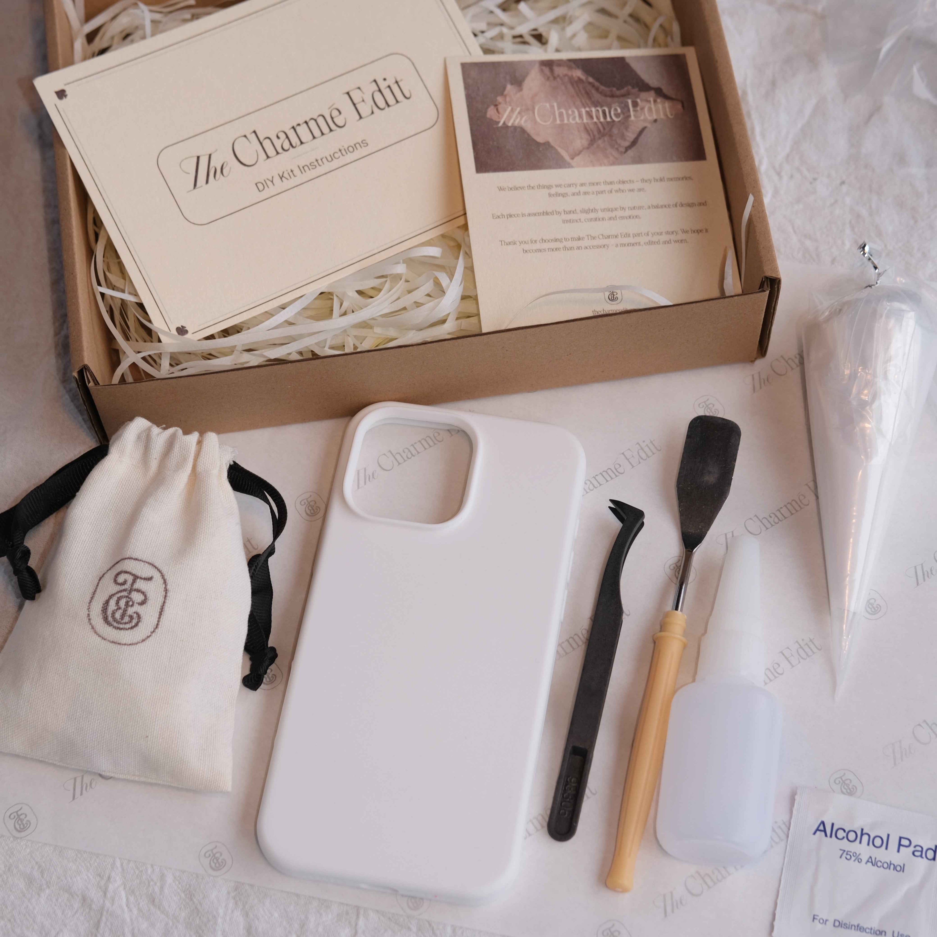 The Charme Edit DIY phone case kit with charms, seashells, tools, and materials to create a handmade custom iPhone case. Perfect for birthdays, creative gifts, craft parties, or a relaxing self-care project. | Craft ideas, custom phone cases, DIY phone cases