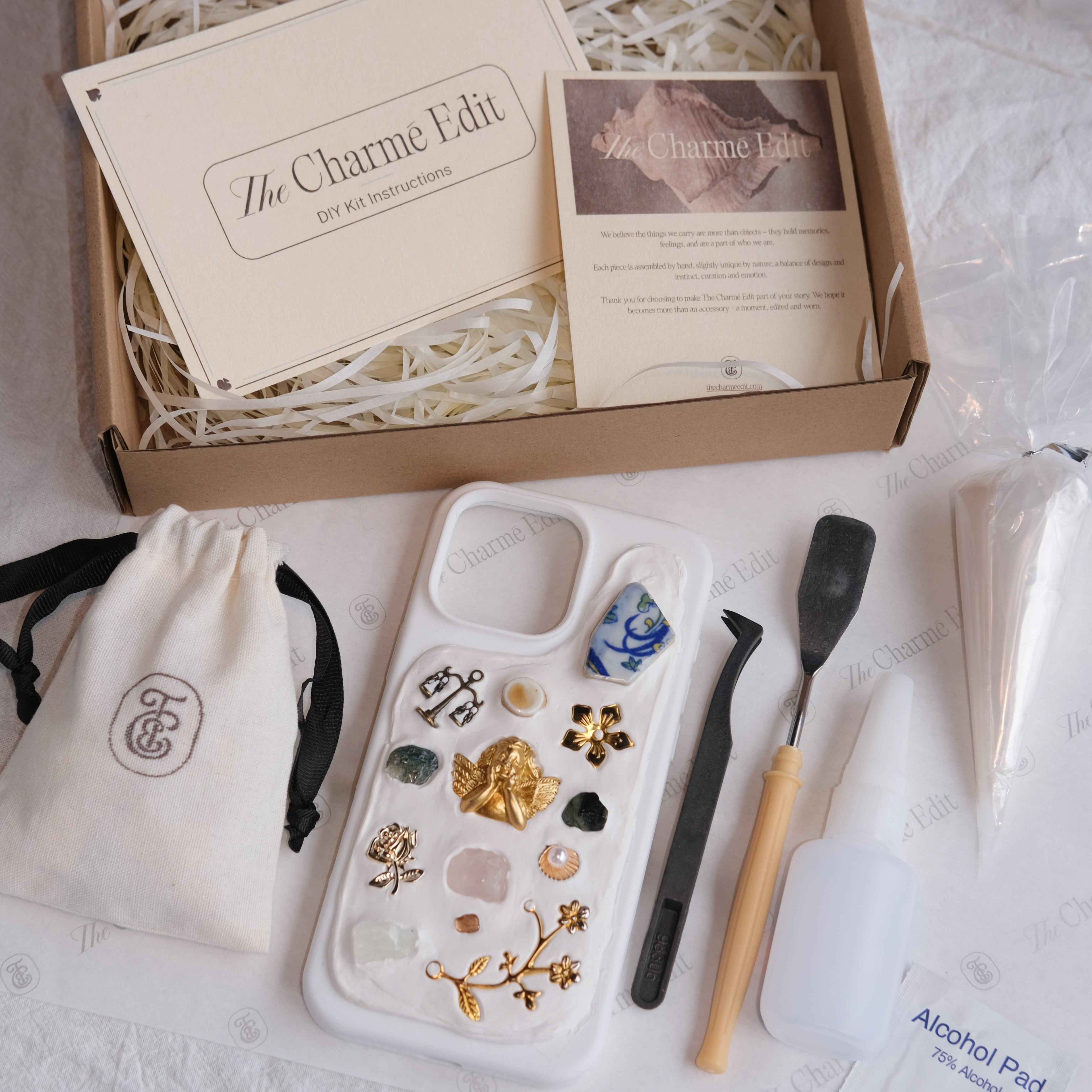 The Charme Edit DIY phone case kit with charms, seashells, tools, and materials to create a handmade custom iPhone case. Perfect for birthdays, creative gifts, craft parties, or a relaxing self-care project. | Craft ideas, custom phone cases, DIY phone cases
