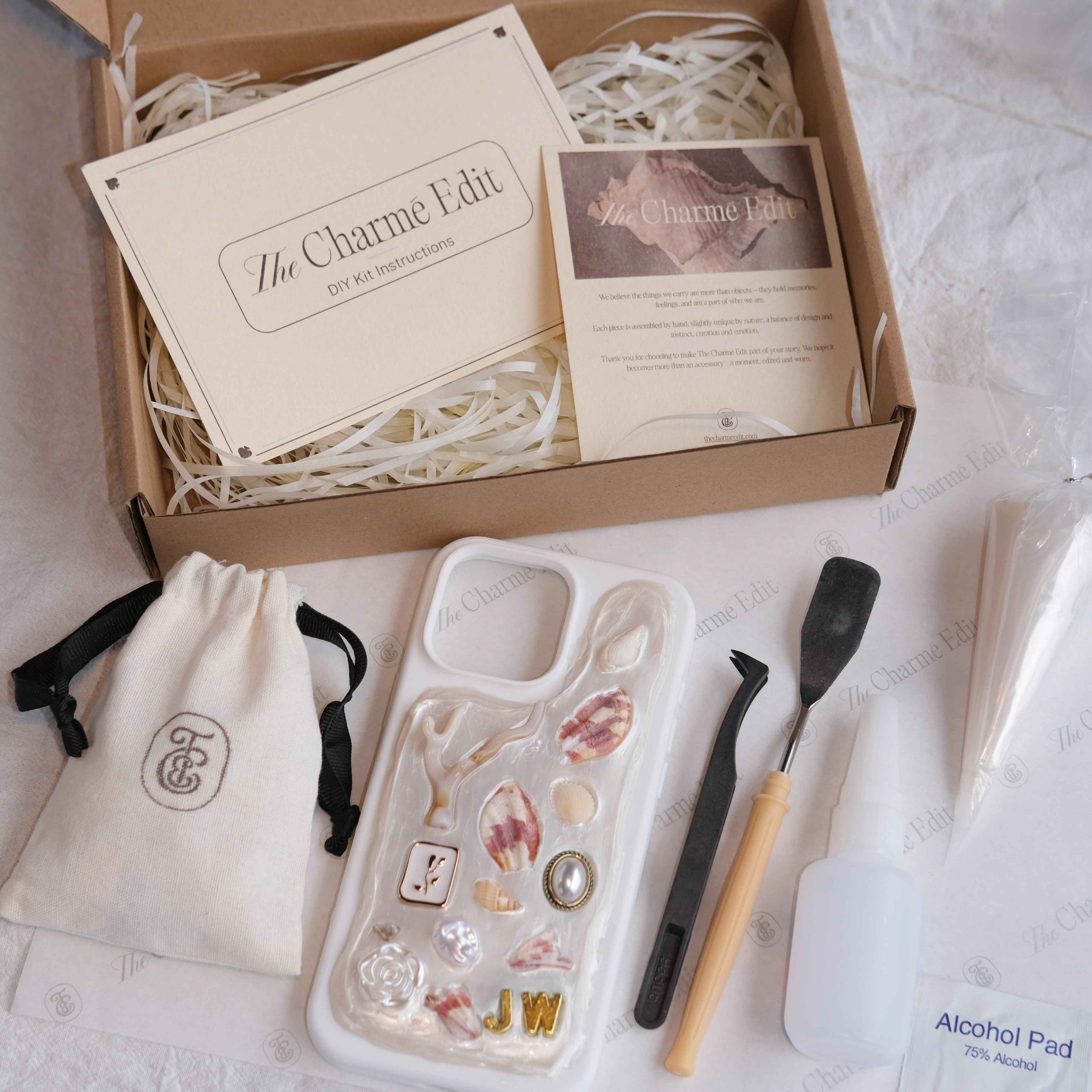 The Charme Edit DIY phone case kit with charms, seashells, tools, and materials to create a handmade custom iPhone case. Perfect for birthdays, creative gifts, craft parties, or a relaxing self-care project. | Craft ideas, custom phone cases, DIY phone cases