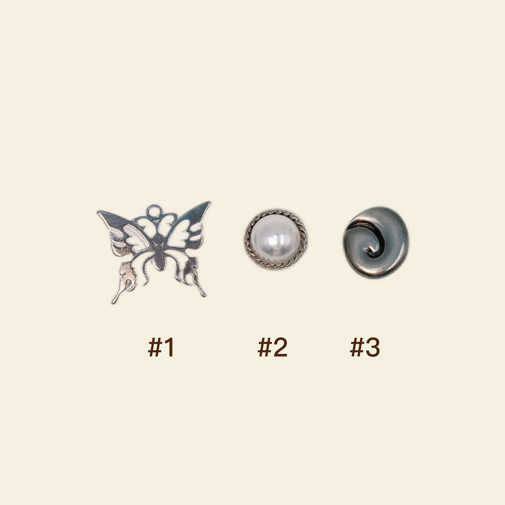 silver phone charms: butterfly and pearl custom phone case accessories.