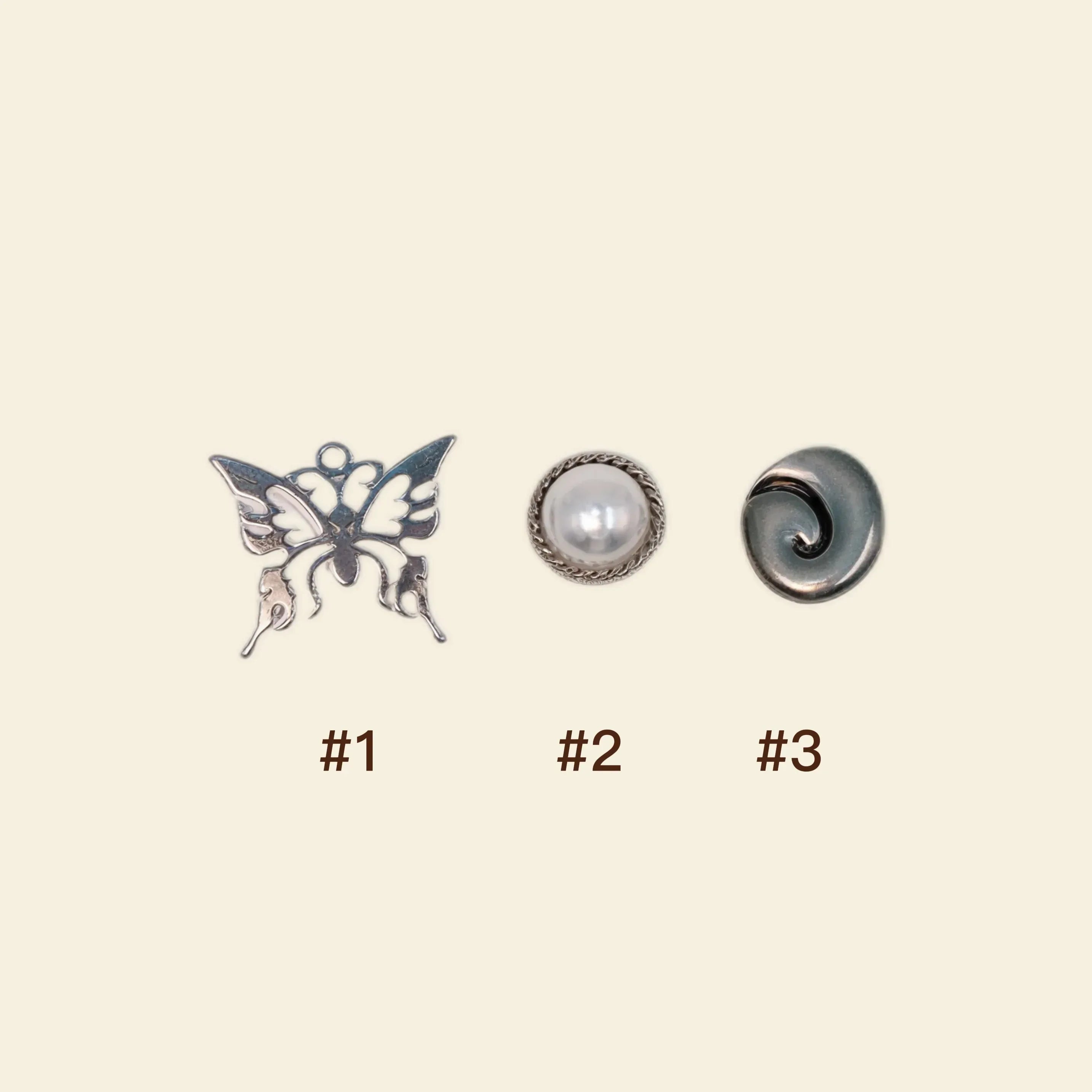 silver phone charms: butterfly and pearl custom phone case accessories.