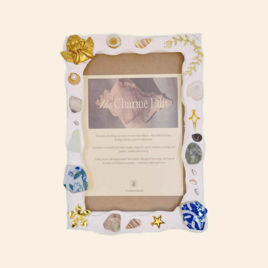 handmade room decor: handmade photo frame with gold angel and seashell charms.