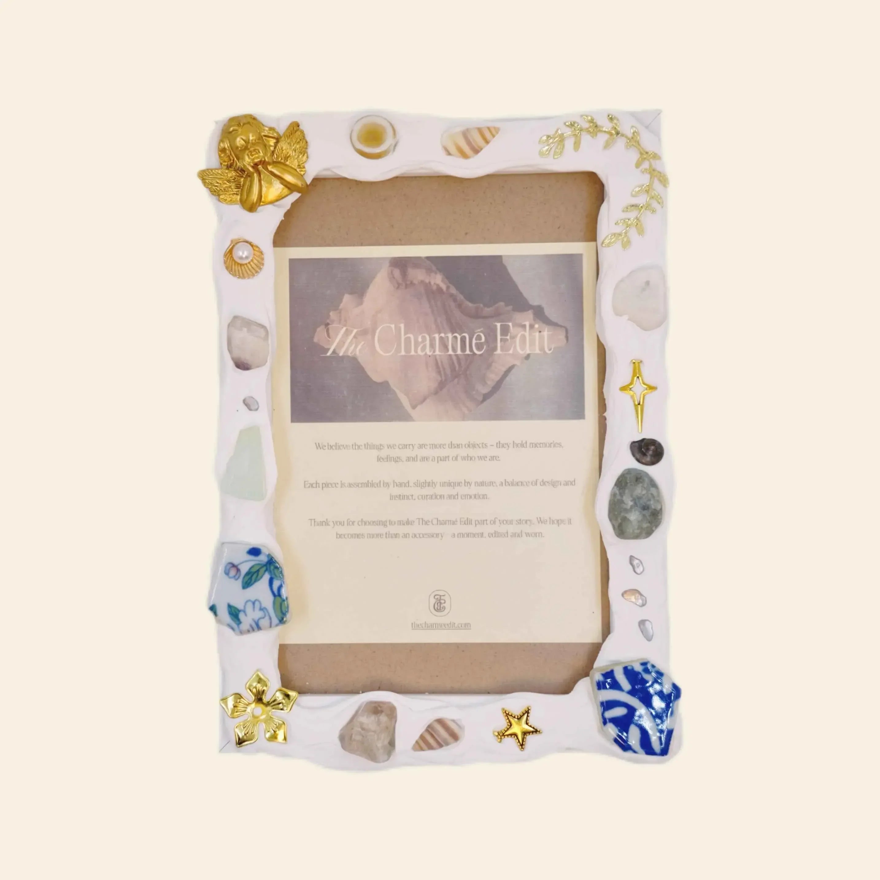 handmade room decor: handmade photo frame with gold angel and seashell charms.