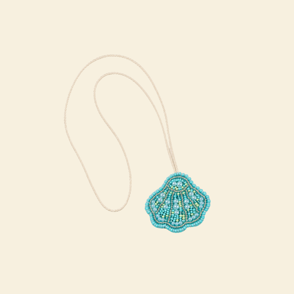 The Côte Shell hand-beaded shell bag charm