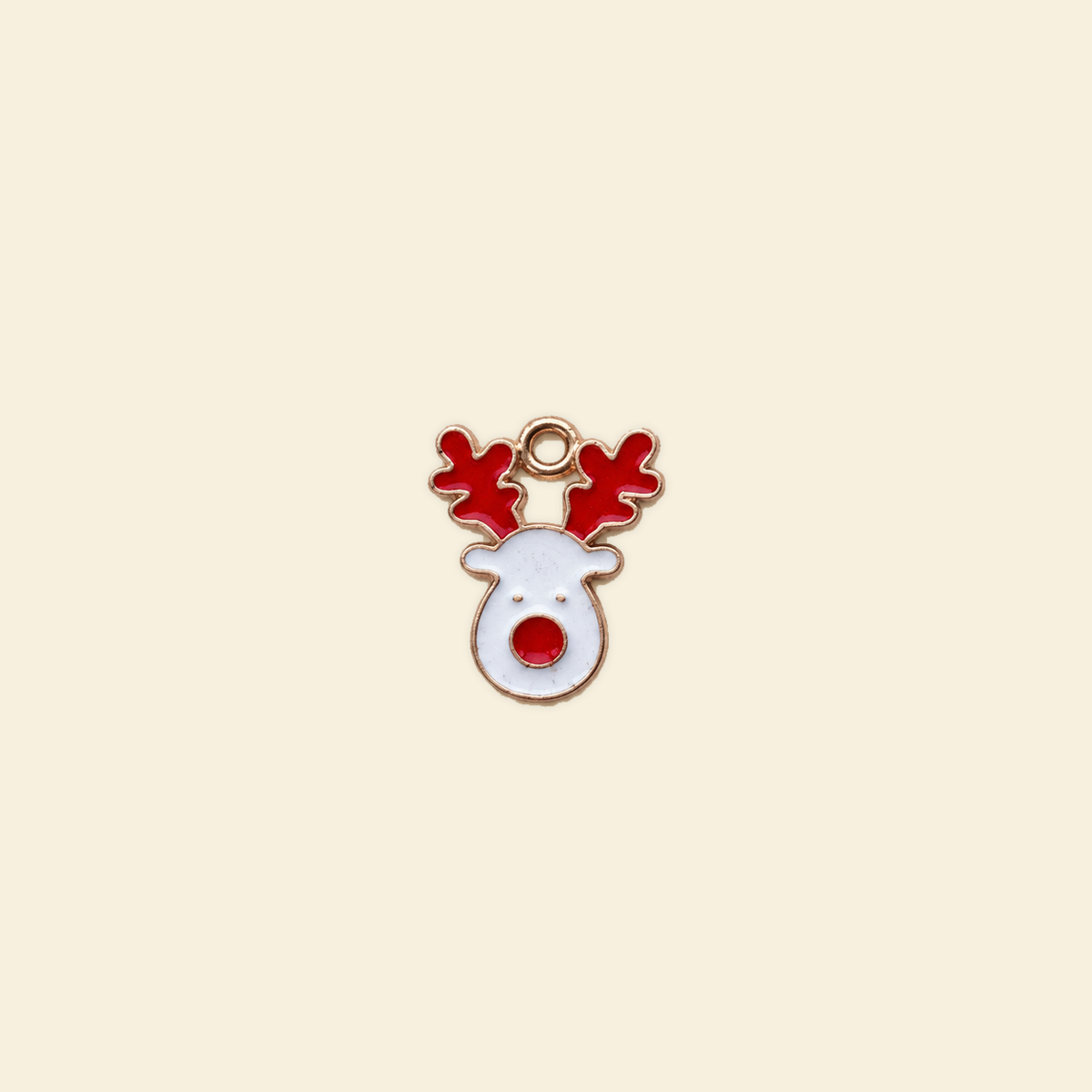 reindeer charm on a solid #f7f0df background