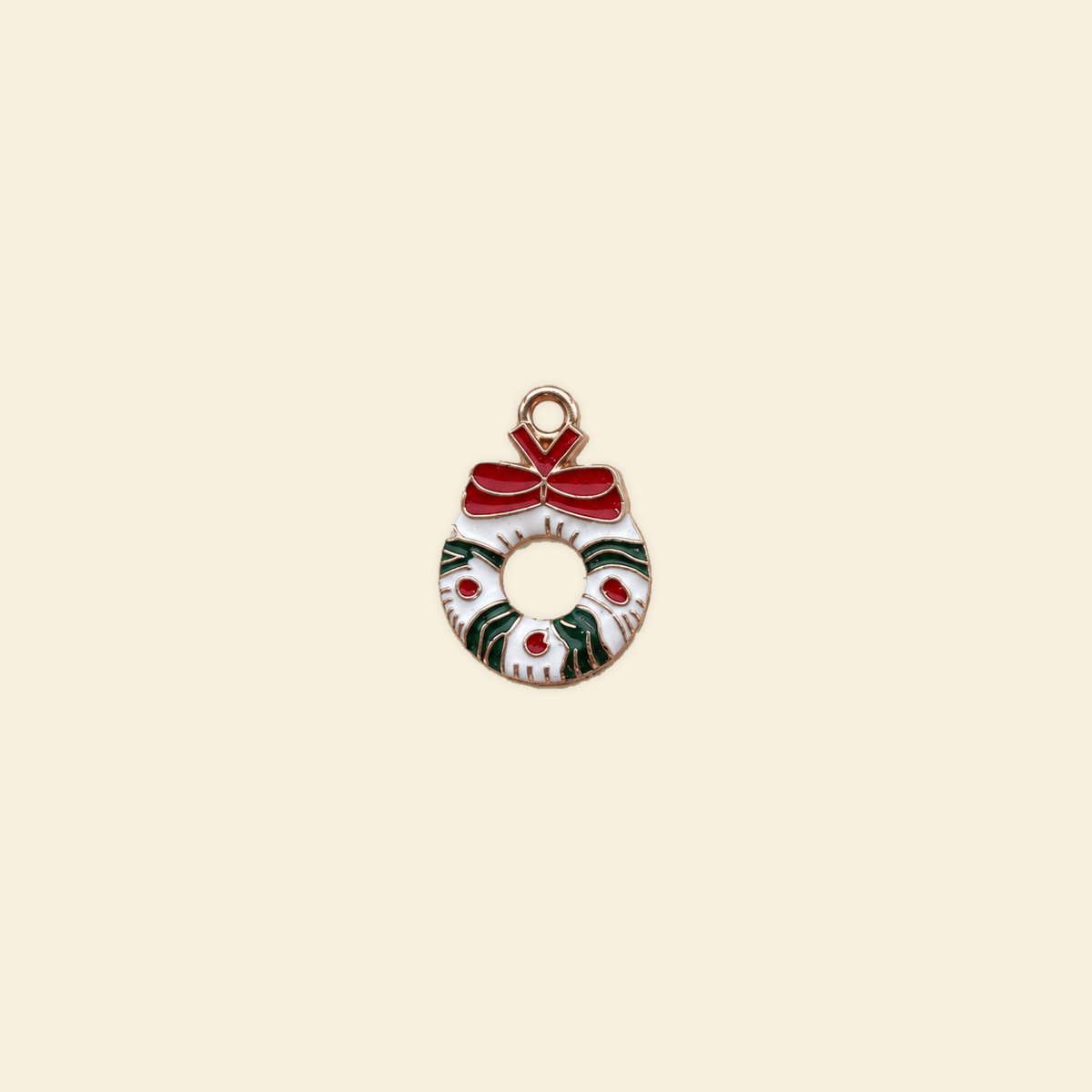 wreath charm on a solid #f7f0df background